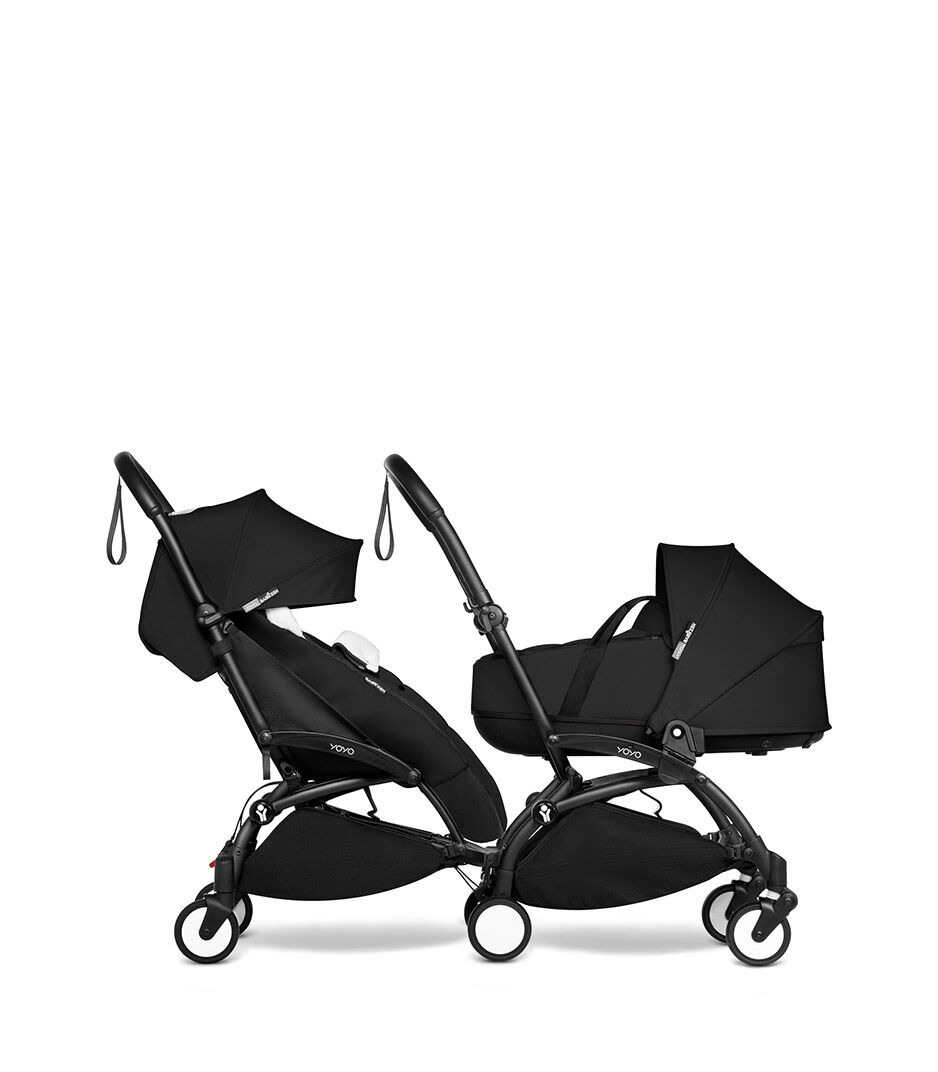 black stroller with footmuff